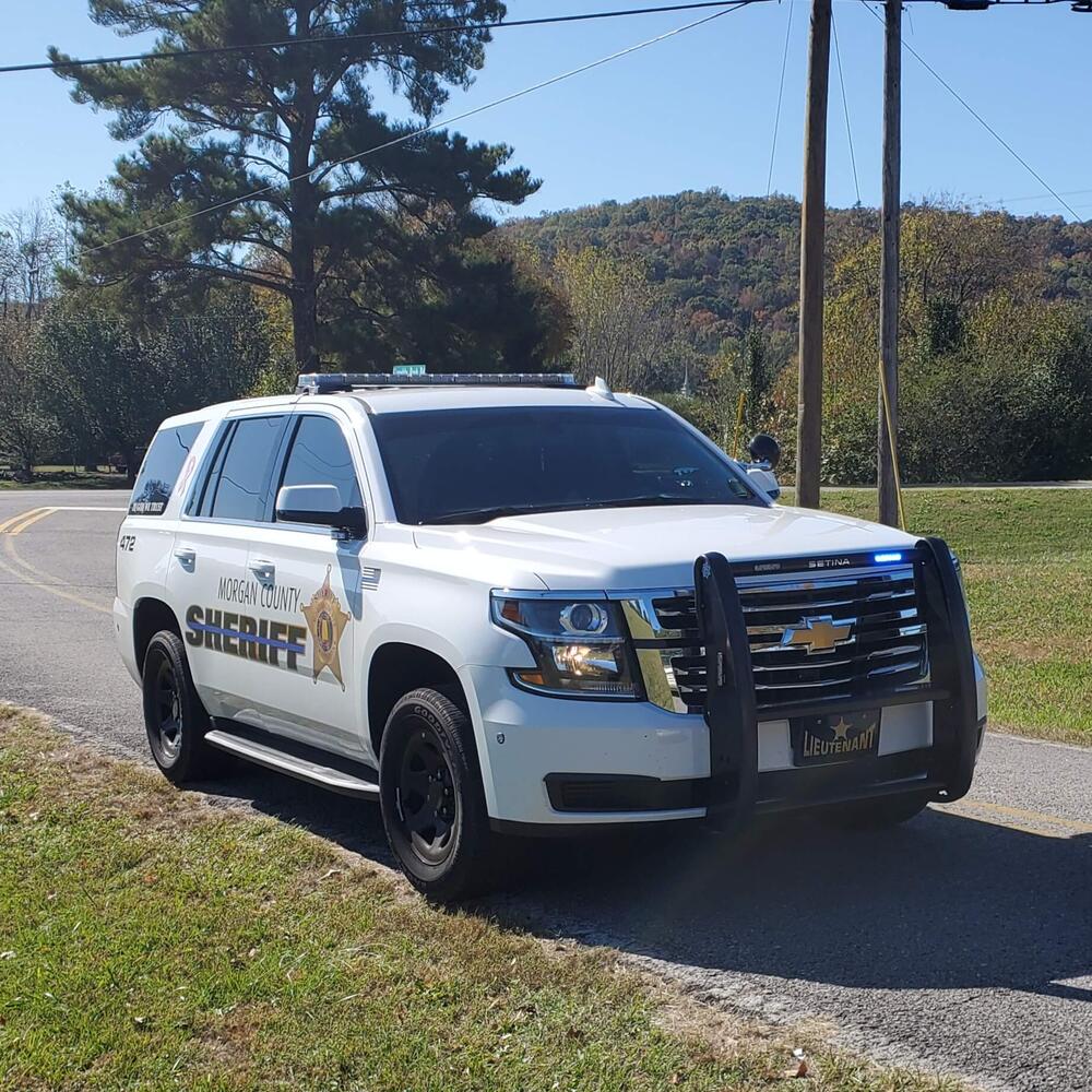 Picture of white patrol unit (a Chevy Tahoe)