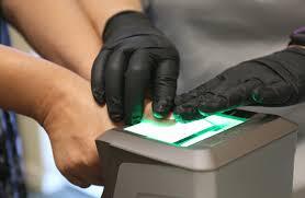 Close-up of finger being scanned for a fingerprint