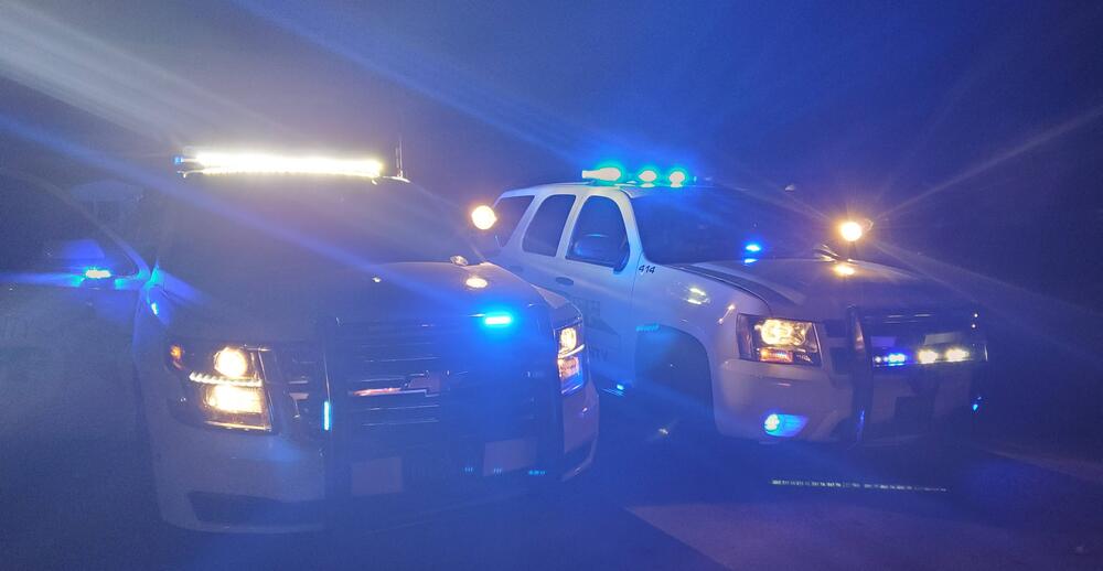 Patrol Units at night with emergency lights on