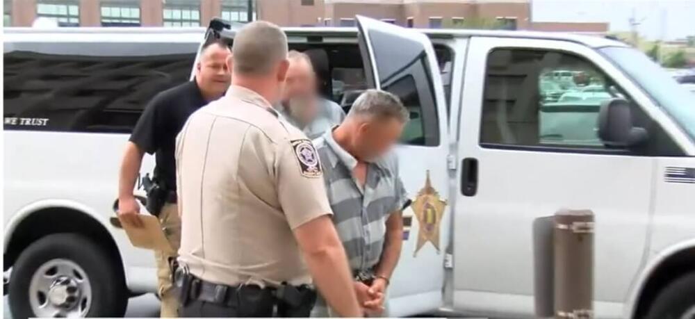 Deputies escorting inmate into courthouse