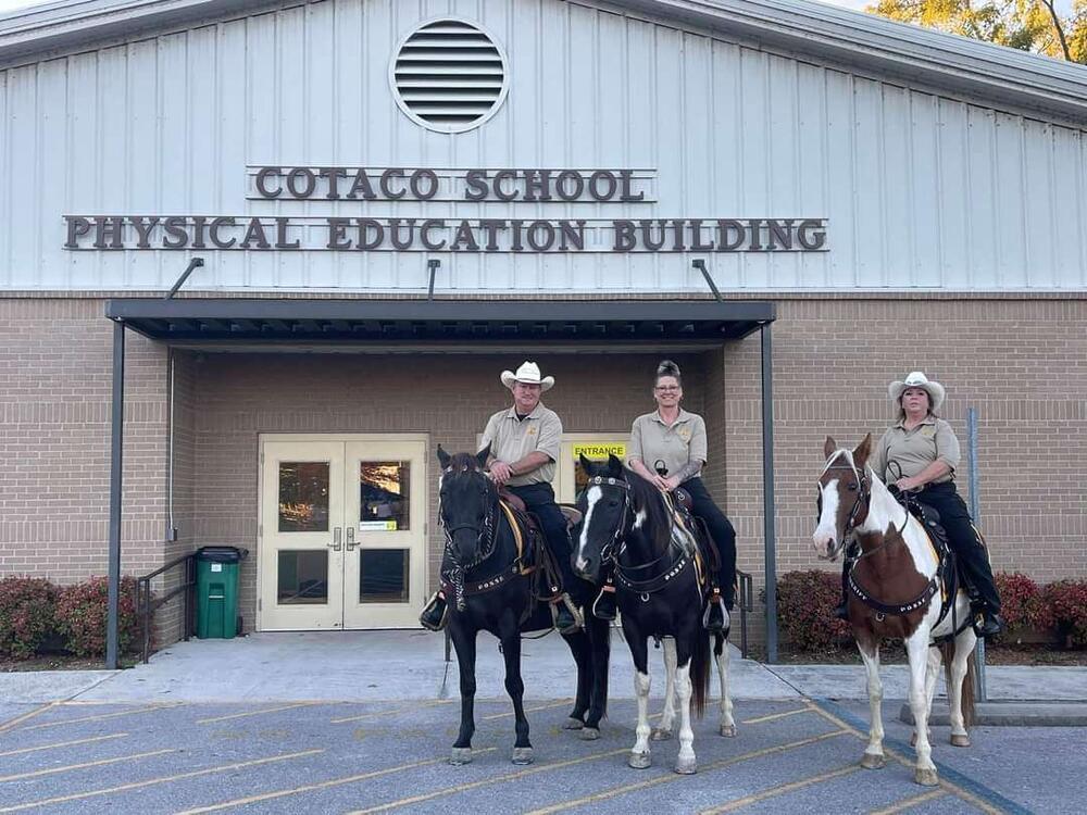 Posse Members on horses at community event