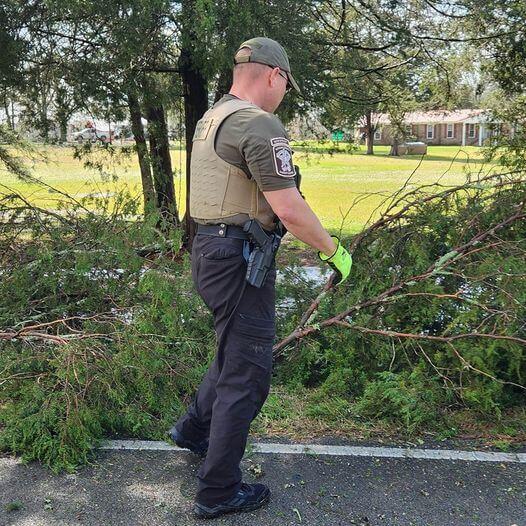 Deputy Mason in Uniform working to clear trees