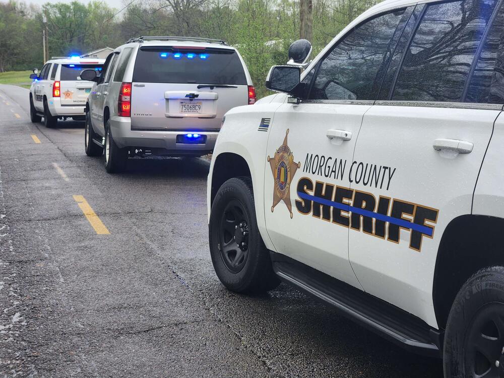 2 marked patrol units and  Unmarked Tahoe