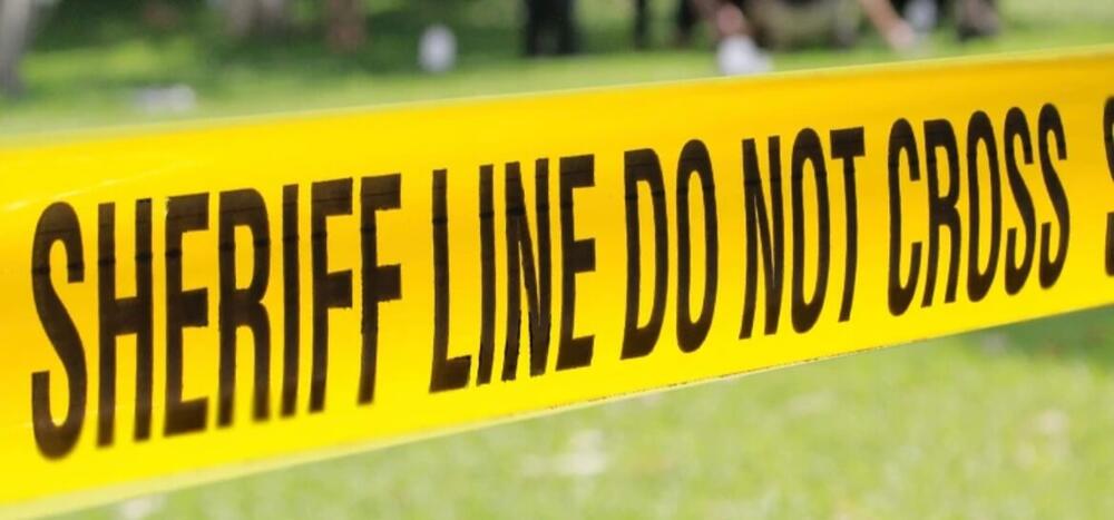 Sheriff Crime Tape in Field